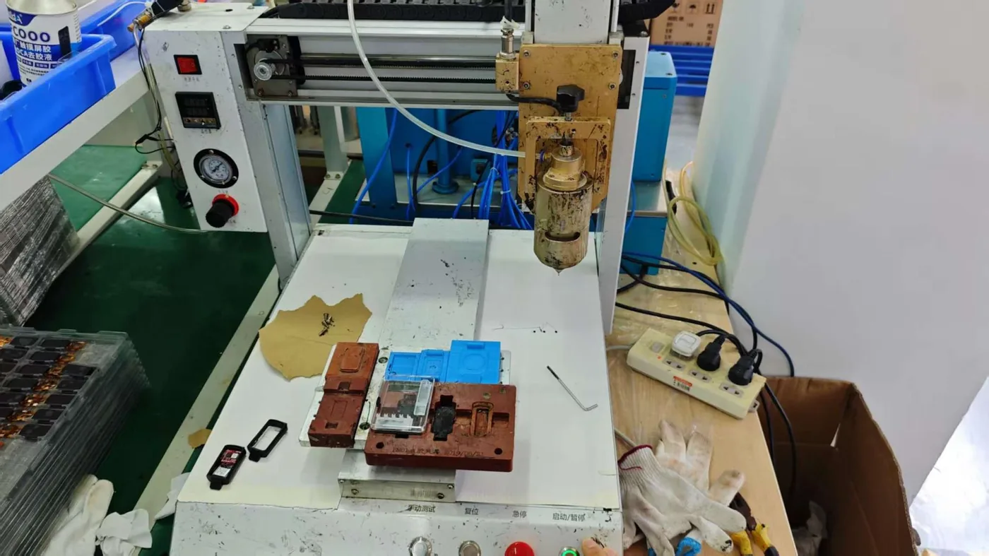Automatic gluing machine on the smartwatch production line