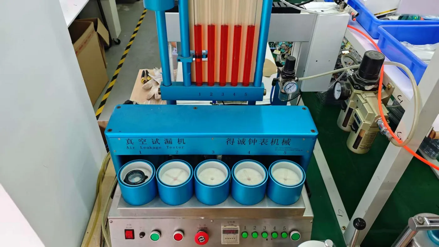 Leakage testing station for smartwatch assemblies