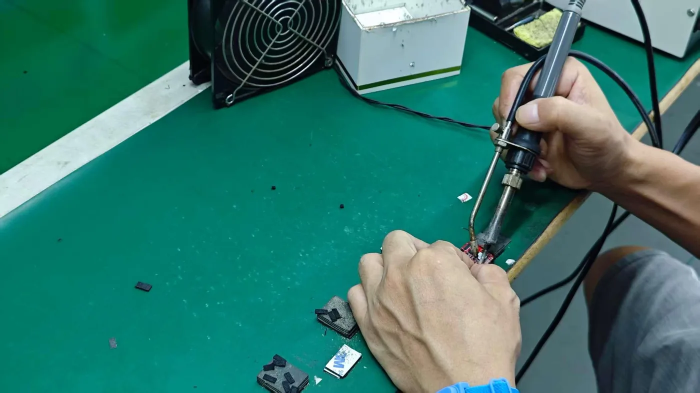 Welding station on the smartwatch production line in Shenzhen