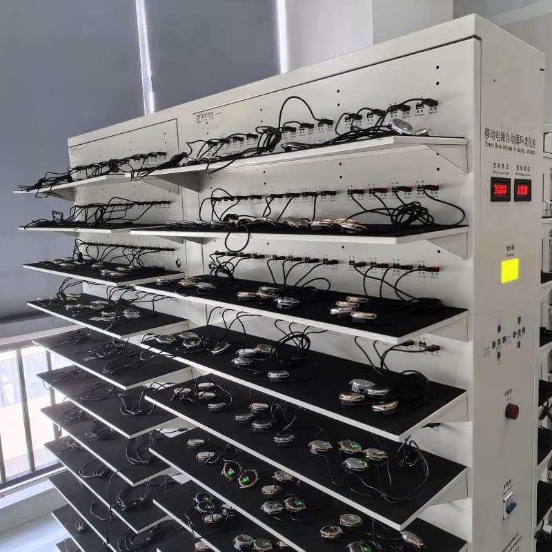 Smartwatches connected to test racks at the manufacturing facility